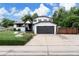 Charming two-story home featuring a two-car garage, manicured lawn, and inviting front porch at 8249 Zephyr St, Arvada, CO 80005