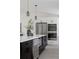 Modern kitchen with a large island, stainless steel appliances, and wine cooler at 8249 Zephyr St, Arvada, CO 80005
