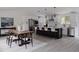 Bright kitchen featuring an island with seating, stainless steel appliances, and ample counter space at 8249 Zephyr St, Arvada, CO 80005