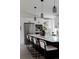 Modern kitchen featuring a large island with seating, stainless steel appliances, and ample cabinet space at 8249 Zephyr St, Arvada, CO 80005