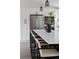 Modern kitchen island with seating, stainless steel appliances, and stylish decor at 8249 Zephyr St, Arvada, CO 80005