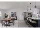 Spacious kitchen and dining area with a large island and modern decor at 8249 Zephyr St, Arvada, CO 80005