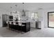 Bright kitchen with an island, stainless steel appliances, and modern design at 8249 Zephyr St, Arvada, CO 80005