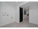 Bright laundry room with white walls, modern flooring, and new appliances, ready for customization at 8249 Zephyr St, Arvada, CO 80005