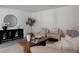 Well-decorated living room featuring neutral furniture, modern decor, and plenty of seating for entertaining at 8249 Zephyr St, Arvada, CO 80005