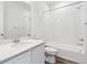 Clean bathroom featuring a shower over tub combination and a white vanity at 9112 Telluride Ct, Commerce City, CO 80022