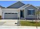 Charming single Gathering home featuring neutral siding, an attached garage, and front yard in a suburban neighborhood at 9112 Telluride Ct, Commerce City, CO 80022