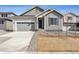 Charming single Gathering home featuring neutral siding, an attached garage, and front yard in a suburban neighborhood at 9112 Telluride Ct, Commerce City, CO 80022