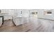 Spacious kitchen and living room featuring hard surface flooring and white cabinets at 9112 Telluride Ct, Commerce City, CO 80022