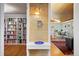 Inviting entryway with hardwood floors leading to office and dining area at 7900 Crest Dr, Lakewood, CO 80214