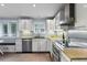 Modern kitchen with stainless steel appliances, granite countertops, and ample cabinet space at 7900 Crest Dr, Lakewood, CO 80214