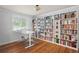 Bright office with built-in bookshelves, hardwood floors and natural light at 7900 Crest Dr, Lakewood, CO 80214