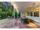 Covered patio with an outdoor dining area and built-in bench, perfect for enjoying meals with a view at 7900 Crest Dr, Lakewood, CO 80214