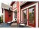 Charming balcony featuring comfortable seating, an umbrella for shade, and views of surrounding greenery at 7777 E 23Rd Ave # 1202, Denver, CO 80238