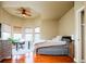 Comfortable bedroom featuring a ceiling fan and bay windows with a desk, offering both rest and workspace at 7777 E 23Rd Ave # 1202, Denver, CO 80238