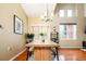Bright dining room featuring hardwood floors, modern lighting, and large windows for natural light at 7777 E 23Rd Ave # 1202, Denver, CO 80238