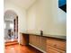 Hallway featuring built-in desk with drawers, perfect for a home office or study area at 7777 E 23Rd Ave # 1202, Denver, CO 80238