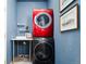 A laundry room is showcased, complete with a stacked washer and dryer set for convenient cleaning at 7777 E 23Rd Ave # 1202, Denver, CO 80238