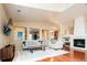 Cozy living area featuring a modern fireplace, stylish furnishings, and ample natural light at 7777 E 23Rd Ave # 1202, Denver, CO 80238