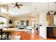 Spacious living area offering hardwood floors, modern decor, open layout, and seamless transitions to other living spaces at 7777 E 23Rd Ave # 1202, Denver, CO 80238
