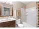 A clean bathroom with a shower-tub combo, and vanity with sink at 7841 S Kalispell Cir, Englewood, CO 80112