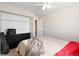 Well-lit bedroom with a closet and an additional adjacent space at 7841 S Kalispell Cir, Englewood, CO 80112
