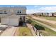 Charming townhome boasts a single-car garage, neat landscaping, and a welcoming entrance at 7841 S Kalispell Cir, Englewood, CO 80112