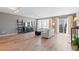 Bright living room with hardwood floors and natural light from the sliding glass door at 7841 S Kalispell Cir, Englewood, CO 80112