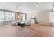 Spacious living room with hardwood floors and sliding glass doors for easy outdoor access at 7841 S Kalispell Cir, Englewood, CO 80112
