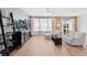 Bright living room with hardwood floors and a ceiling fan for added comfort at 7841 S Kalispell Cir, Englewood, CO 80112