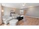 Open-concept living room with hardwood floors and a staircase to the upper level at 7841 S Kalispell Cir, Englewood, CO 80112