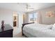 Comfortable main bedroom with carpet and a ceiling fan for added comfort at 7841 S Kalispell Cir, Englewood, CO 80112