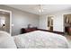 Cozy main bedroom with a large dresser, walk-in closet and a bathroom at 7841 S Kalispell Cir, Englewood, CO 80112