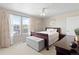 Inviting main bedroom with carpet, a ceiling fan, and natural light from the windows at 7841 S Kalispell Cir, Englewood, CO 80112