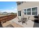 Back patio featuring a privacy fence, a grill, and a patio table with umbrella at 7841 S Kalispell Cir, Englewood, CO 80112