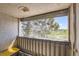 Enclosed balcony with an outdoor view of a tree and field at 10762 E Exposition Ave # 336, Aurora, CO 80012