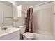 The bathroom features a vanity, toilet, shower-tub combo and tiled walls at 10762 E Exposition Ave # 336, Aurora, CO 80012