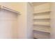 Open closet with shelving and clothing rod for storage at 10762 E Exposition Ave # 336, Aurora, CO 80012