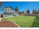 Expansive backyard with lush green lawn, perfect for outdoor activities and relaxation at 4871 S Dunkirk Way, Centennial, CO 80015