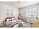 Bright bedroom featuring neutral walls, carpet flooring and decorated with artwork and stuffed animals at 4871 S Dunkirk Way, Centennial, CO 80015