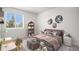 Cozy bedroom showcases neutral walls, carpet flooring, window, and decor at 4871 S Dunkirk Way, Centennial, CO 80015