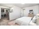 Bright bedroom showcasing a well-organized walk-in closet and carpet flooring at 4871 S Dunkirk Way, Centennial, CO 80015