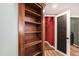 Built-in shelving lines a closet containing laundry at 4871 S Dunkirk Way, Centennial, CO 80015