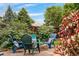 Relaxing backyard with fire pit, comfortable seating, and lush landscaping at 10450 Iris Way, Broomfield, CO 80021