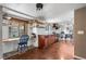 Sunlit kitchen with ample counter space, stylish backsplash, and blue desk area at 10450 Iris Way, Broomfield, CO 80021