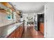 Open concept kitchen with modern appliances and views to dining area and backyard at 10450 Iris Way, Broomfield, CO 80021