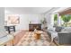 Cozy living room showcasing modern decor, stylish rug, and ample natural light at 10450 Iris Way, Broomfield, CO 80021