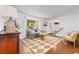Sun-lit living room with hardwood floors, neutral furniture, and a cozy atmosphere at 10450 Iris Way, Broomfield, CO 80021