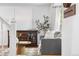 Bright living room with hardwood floors, neutral furnishings, and a decorative accent table at 10450 Iris Way, Broomfield, CO 80021
