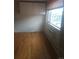 Cozy bedroom featuring hardwood floors, bright natural light, and a window A/C unit at 1131 N Lafayette St # 304, Denver, CO 80218